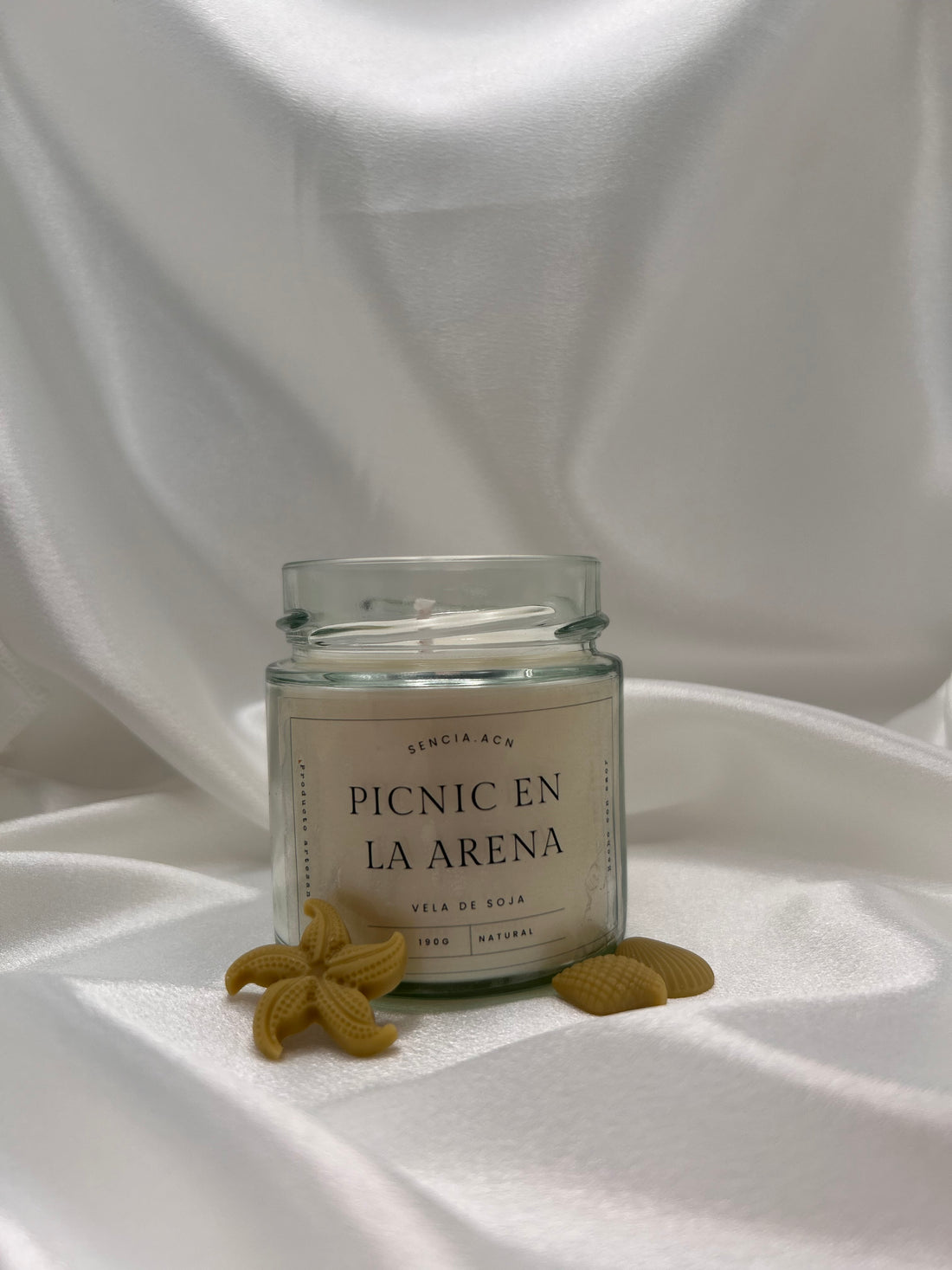 vela aromática picnic en la arena