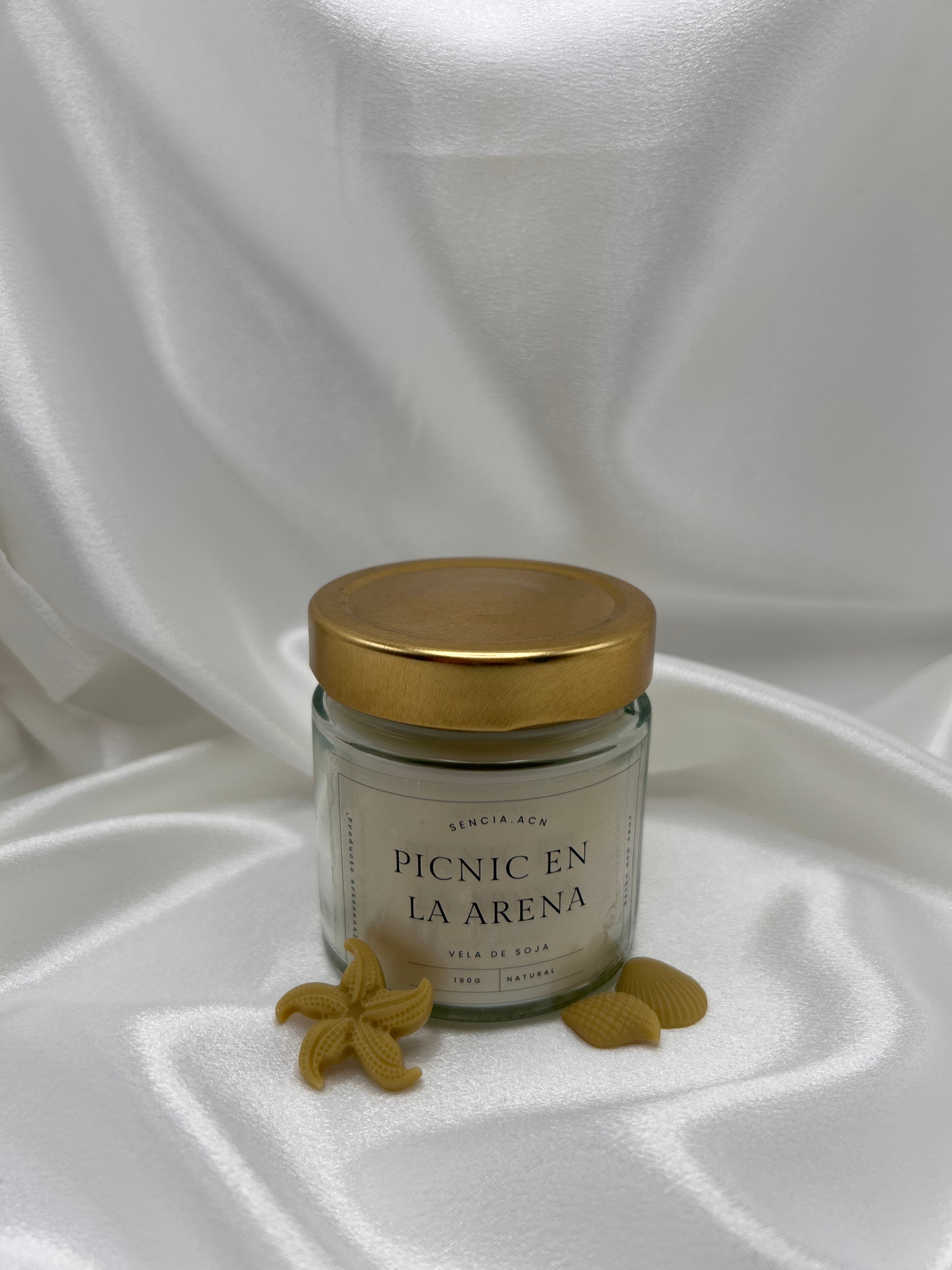vela aromática picnic en la arena